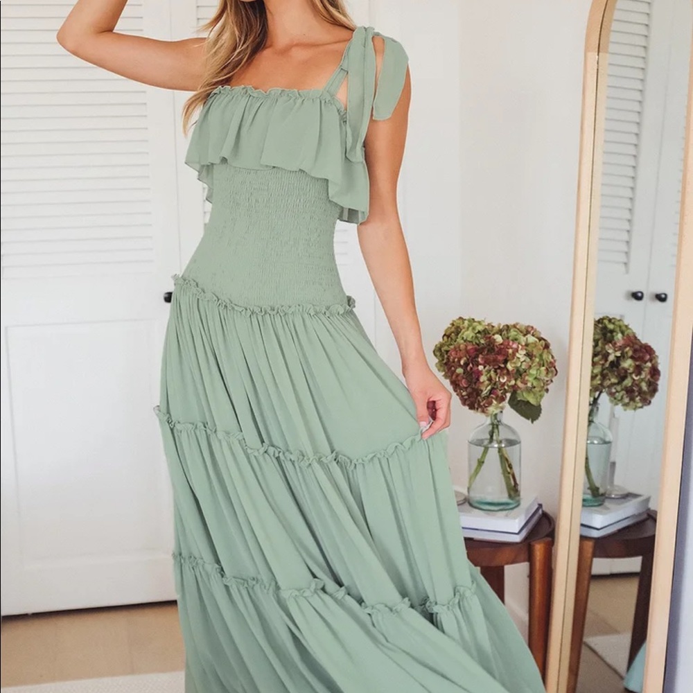 “Like a fairy tale sage green smocked tie-strap tiered maxi dress” from Lulus